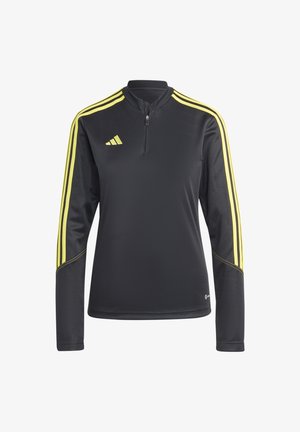 Zwarte sportieve pullover met een kwart-rits, voorzien van gele strepen langs de schouders en een gestructureerde stof. Adidas-logo op de borst.