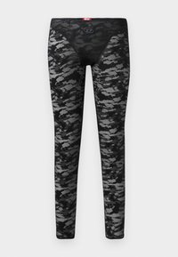 Collant neri con una sovrapposizione in pizzo testurizzato che presenta un motivo camouflage grigio. Vita elastica con un piccolo dettaglio del logo sul davanti.
