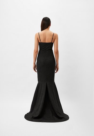 Black evening gown with a fitted bodice, spaghetti straps, and a flared hem. The fabric has a textured, crinkled appearance.