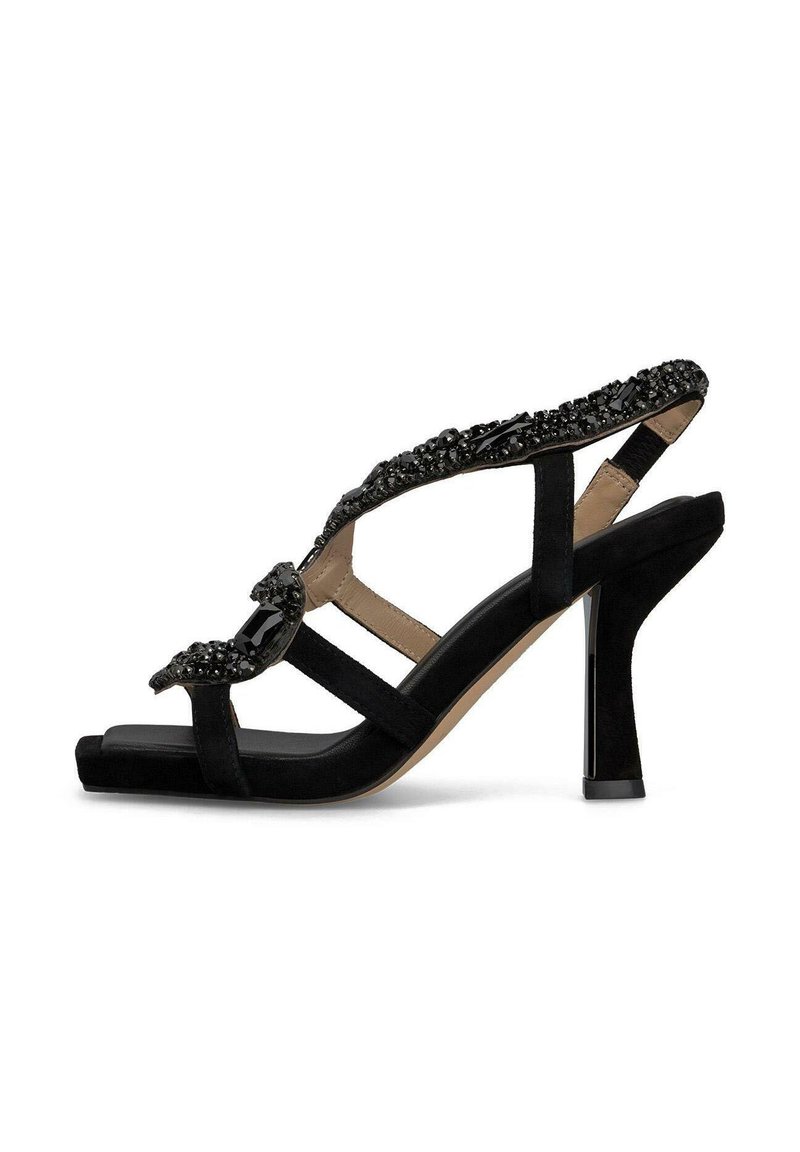 Schwarze Wildleder-High-Heelsandalen mit verzierten Riemen, offenes Zehen-Design und einem schlanken, geometrischen Absatz. Glatte und strukturierte Akzente.