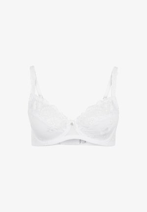 Reggiseno bianco in pizzo con ricami floreali, spalline regolabili e un piccolo charm decorativo al centro. Materiale morbido con un design elegante.