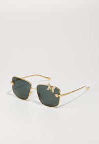 Saulesbrilles - gold-coloured