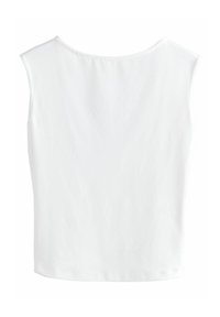 Top blanc sans manches avec un col rond, fabriqué en tissu de coton lisse, présentant une coupe simple et des lignes épurées, sans embellissements visibles.