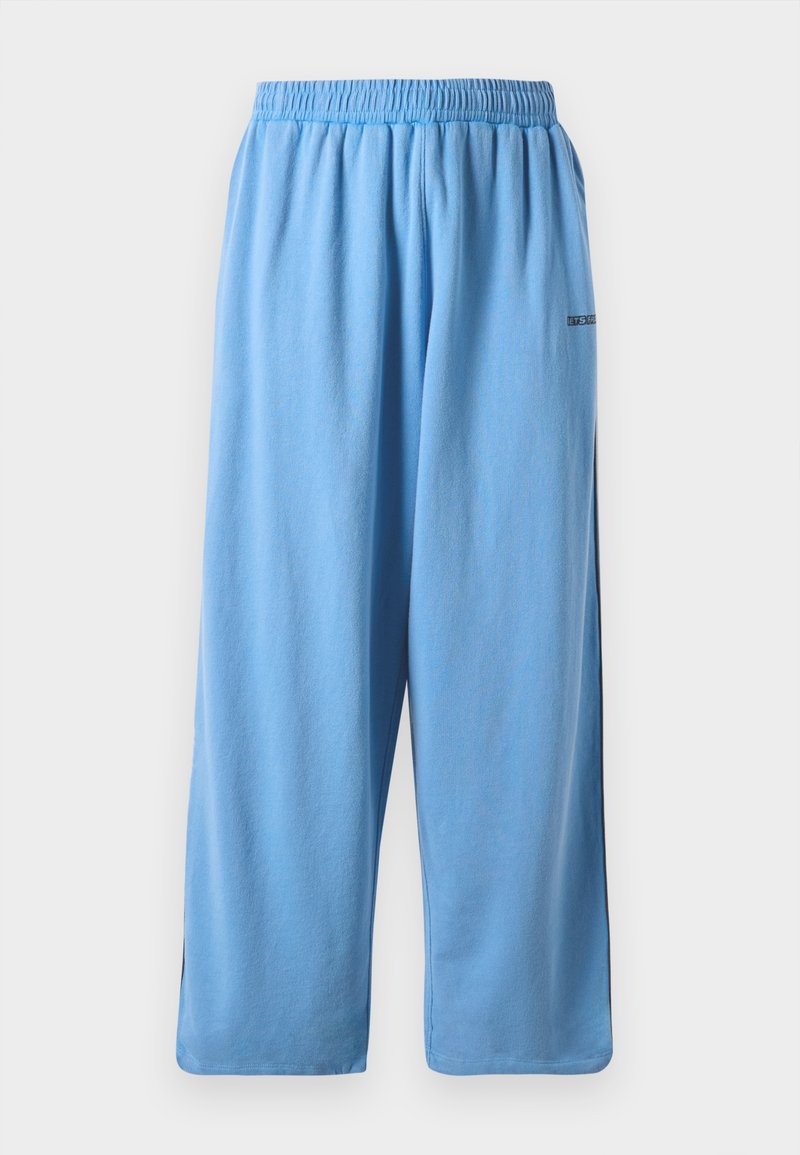 Blaue, leichte Jogginghose aus weichem Material. Verfügt über einen elastischen Bund und seitliche Schlitze. Einfaches Design mit minimalem Branding.