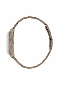 Metallkellaga kell, millel on pronksitooni roostevaba terasest rihm. Sellel on ristkülikukujuline korpus, selge klaas ja tekstuuriga pind detailsete lingitega.