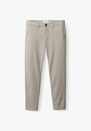 Beige bomuldsbukser med slim fit, der har to forlommer, en knaplukning og diskrete stikninger langs sømmene.