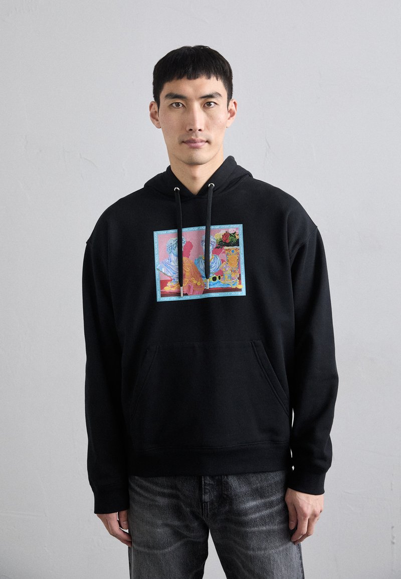 Black hoodie featuring a colorful, framed graphic design on the front. Material appears soft; the fit is casual with a front pocket.