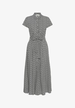 Abito nero con maniche corte, colletto, chiusura frontale a bottoni e pois bianchi. Il tessuto è leggero con una vita aderente e gonna svasata.