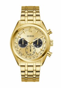 Montre Guess couleur or avec un cadran rond, des sous-cadrans noirs, trois boutons chronographes et un bracelet en métal lié.