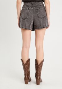 Cache Cache Gonna a campana - denim noir
