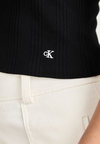 Calvin Klein Jeans VARIEGATED HALF ZIP - Basic póló - black