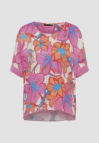 Blusenshirt mit kurzen Ärmeln und lockerer Passform. Verziert mit rosa, orangefarbenen und blauen Blumen auf einem cremefarbenen Hintergrund. Glatte Textur mit Rundhalsausschnitt.