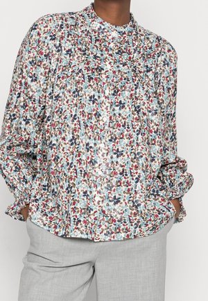 Langärmlige Bluse mit Blumenmuster, banded Kragen, gerafften Ärmeln und Knöpfen, in Farben wie Blau, Rot und Beige auf einem hellen Hintergrund.