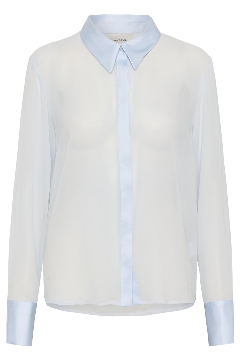 Witte transparante lange mouwen blouse met lichtblauwe kraag, knoopsluiting en manchetten, met een losse pasvorm en verborgen knopen.