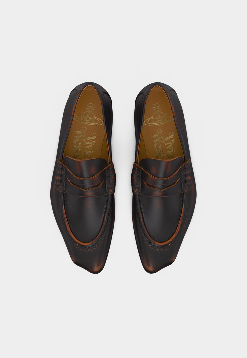 Pair of dark brown leather loafers with pointed toes and stitched detailing, displayed top-down on a light background.