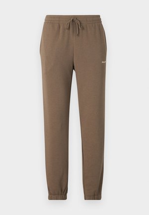 Braune, weiche Sweatpants mit einem elastischen Bund und verstellbarem Kordelzug. Schmal zulaufende Beine mit elastischen Bündchen. Markenlogo auf der linken Seite.