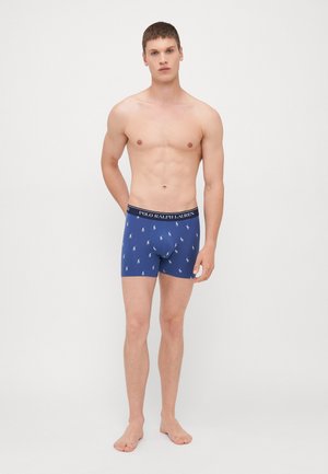 Férfi kék boxer alsónadrág kis fehér polo logóval, elasztikus derékpánttal, amin "POLO RALPH LAUREN" felirat található, pamut anyagból készült, formázott dizájn.