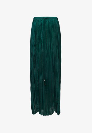 Faltenmaxirock in tiefgrün, mit weichem, glänzendem Material, elastischem Bund und kleinen dekorativen Akzenten am Saum.