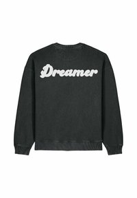 Sweat-shirt noir avec le mot "Dreamer" en grandes lettres blanches stylisées dans le dos, doté de poignets et d'un ourlet côtelés.