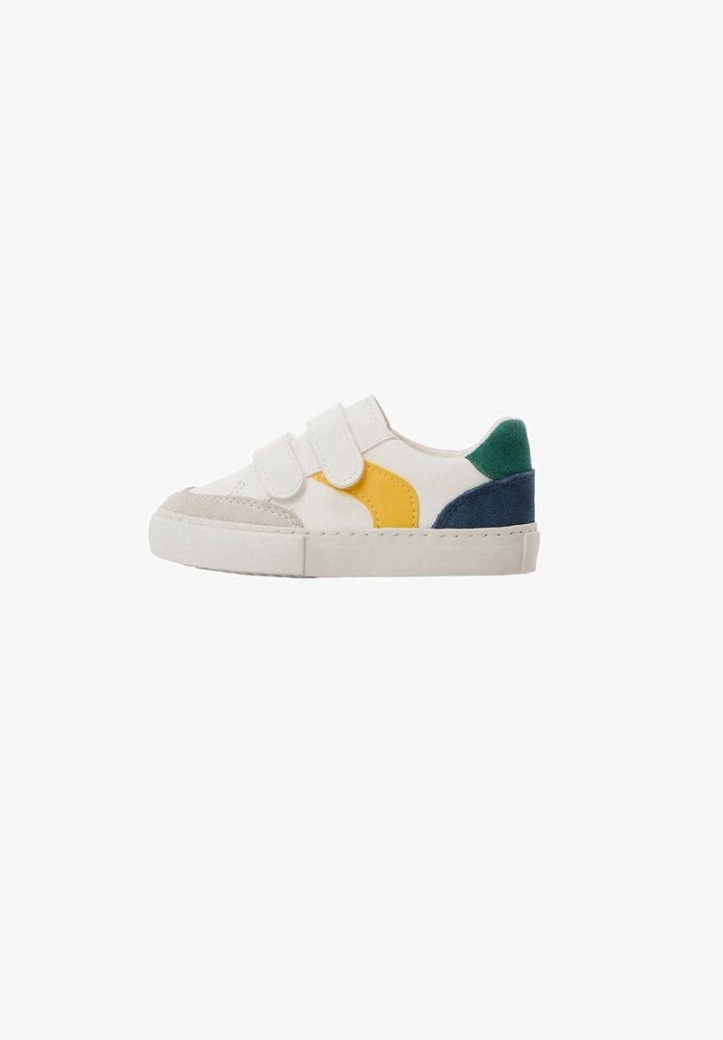 White sneaker featuring Velcro straps, multicolored accents in yellow, navy, and green, with a textured beige rubber toe cap.
