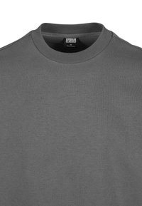 Felpa grigia a collo rotondo realizzata in un morbido tessuto misto cotone. Presenta un collo a coste e una texture morbida, adatta per un abbigliamento casual.