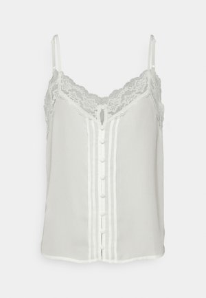 Biała bezrękawnikowa bluzka z koronkowym wykończeniem, zapinana na guziki z przodu i z regulowanymi ramiączkami spaghetti.