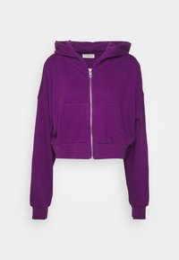 Felpa corta viola realizzata in morbido tessuto, con zip frontale, ampie tasche e cappuccio con coulisse e polsini a costine.