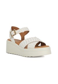 Witte wedge sandalen met gevlochten banden, verstelbare gesp en een gestructureerde zool. Heeft een gladde tan voering en een lichtgewicht ontwerp.