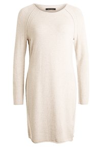 Abito lungo beige chiaro con maniche lunghe, scollatura rotonda e sottili spacchi laterali. La trama del tessuto morbido aggiunge un aspetto casual e confortevole.