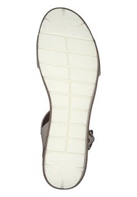 Semelle de sandale brun clair avec caoutchouc blanc texturé, présentant des rainures horizontales et une sangle latérale pour un soutien supplémentaire. Taille 42 indiquée.