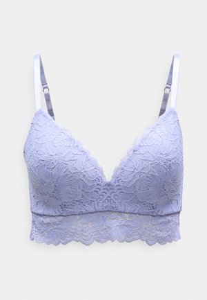 Lace bralette in light lavender with a V-neck design, scalloped edges, and adjustable satin straps. Floral patterns throughout the fabric.