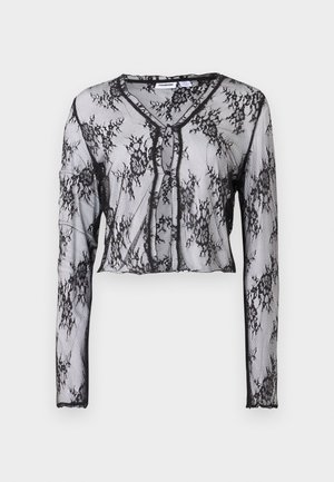 Gjennomsiktig svart blonder langermet topp med blomster mønstre, kort design, V-hals og knappelukking foran. Myk tekstur.