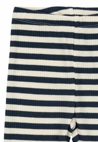Randiga leggings i ribbad tyg, med växlande marinblå och krämfärgade horisontella ränder samt en elastisk midja.