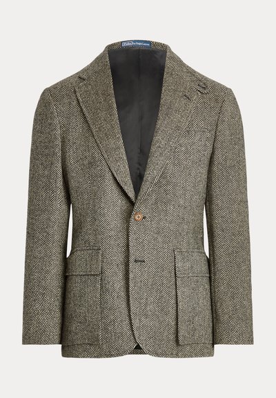 Blazer homme marron et blanc à motif chevrons, avec revers crantés, fermeture à un bouton et poches avant à rabat.