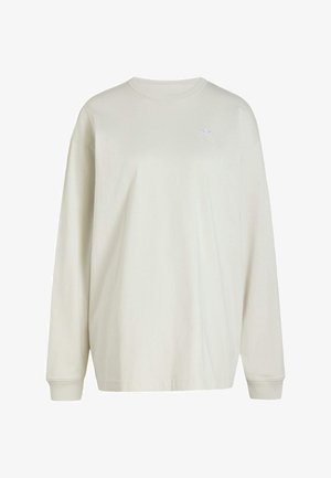 Sweat-shirt à manches longues écru avec col rond, poignets côtelés et petit logo Adidas sur la partie supérieure gauche de la poitrine.