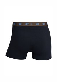 Navy blue boxer briefs made of soft fabric, featuring a brown waistband with blue "CR7" logo repeated. Smooth texture, fitted design.