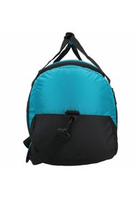 Round backpack with a turquoise upper and black lower section. Made of durable fabric, featuring a top handle and adjustable shoulder strap.