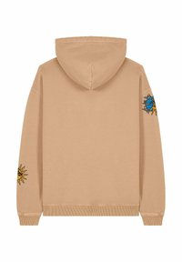 Beige színű, kapucnis pulóver laza fazonnal, kék és sárga napok és szemek grafikáival az ujjakon. Sima tapintású, pamut keverék.