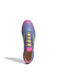Sport shoe featuring a fitted design in purple with pink and yellow accents, textured upper, and laces. Includes a padded collar.