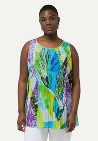 Mouwloze tuniek van lichtgewicht stof, met een abstract ontwerp in groene, blauwe, paarse en zwarte kleuren. Ronde hals, ontspannen pasvorm.