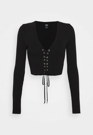 Stickad tröja - black