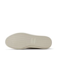 Suela de sneaker beige claro con un patrón de agarre texturizado, que presenta un parche de logo rectangular. Material de goma suave, forma de punta redondeada.