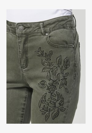 Koroshi Liibuvad teksad - verde oscuro dark green