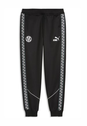 Schwarze Trainingshose mit elastischem Bund, geometrischen Seitenstreifen, weißen KING- und Puma-Logos auf der Vorderseite und gerippten Bündchen an den Knöcheln.
