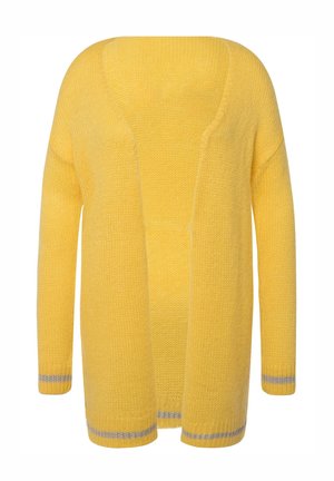 Keltainen neulecardigan, jossa on avonainen etuosa, pitkät hihat ja hopeiset raidat hihojen ja helmuksen reunassa. Pehmeä kangas ja rento malli.