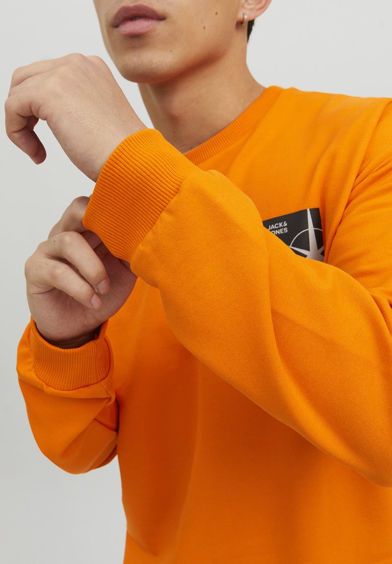 orange crewneck
