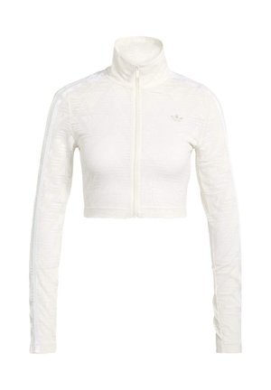 White cropped zip jacket with textured pattern, high collar, and white stripes along the sleeves. Features a subtle logo on chest.