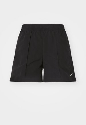 Pantalones cortos negros hechos de una tela ligera con una cinturilla elástica, que presentan pliegues frontales y un pequeño logo de Nike en blanco en la parte inferior izquierda.