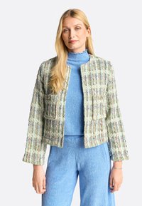 Textured, multicolored tweed jacket in green, blue, and beige, features a cropped design with two front pockets and gold-tone accents.