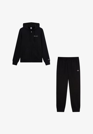 Zwarte katoenen zip-up hoodie met zijzakken en logo op de borst, gecombineerd met bijpassende zwarte trainingsbroek met elastische tailleband en logo.